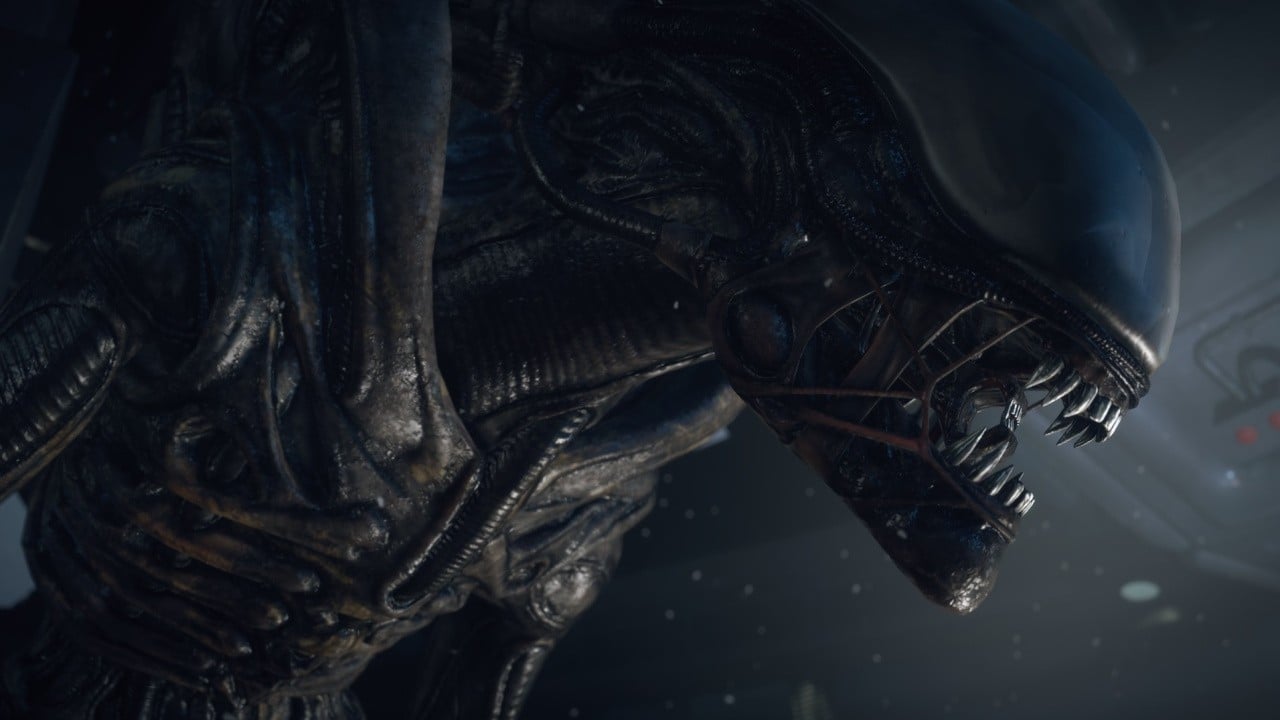 A dark Alien: Isolation-style save station scene in a rainy sci-fi setting.
