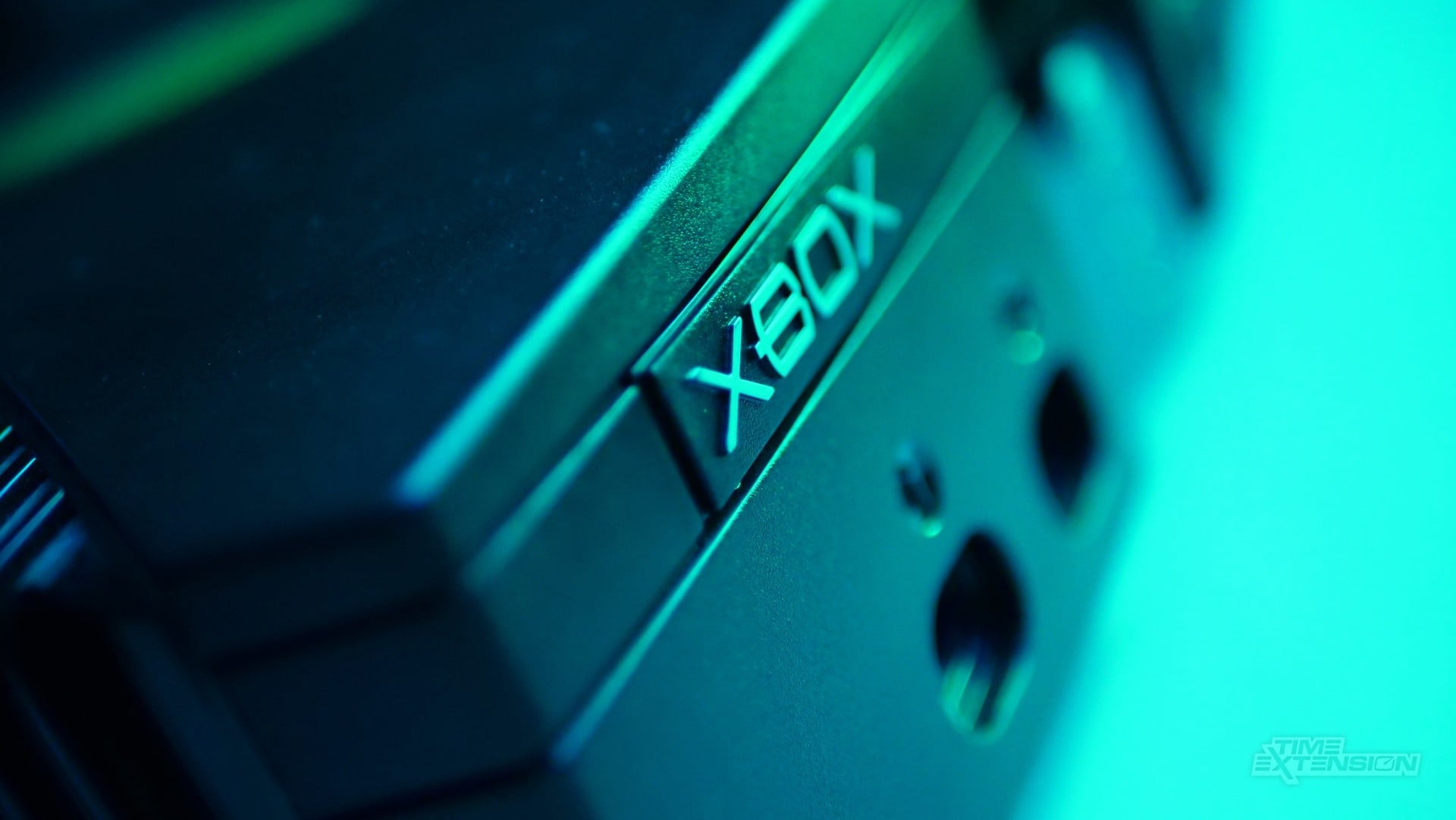 Original Xbox console shown with a modern modding board concept nearby